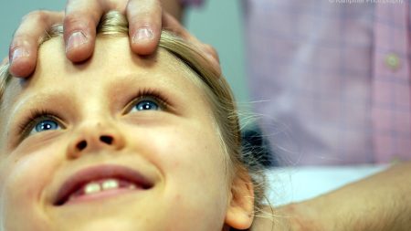 Close up of young girl receiving osteopathic treatment